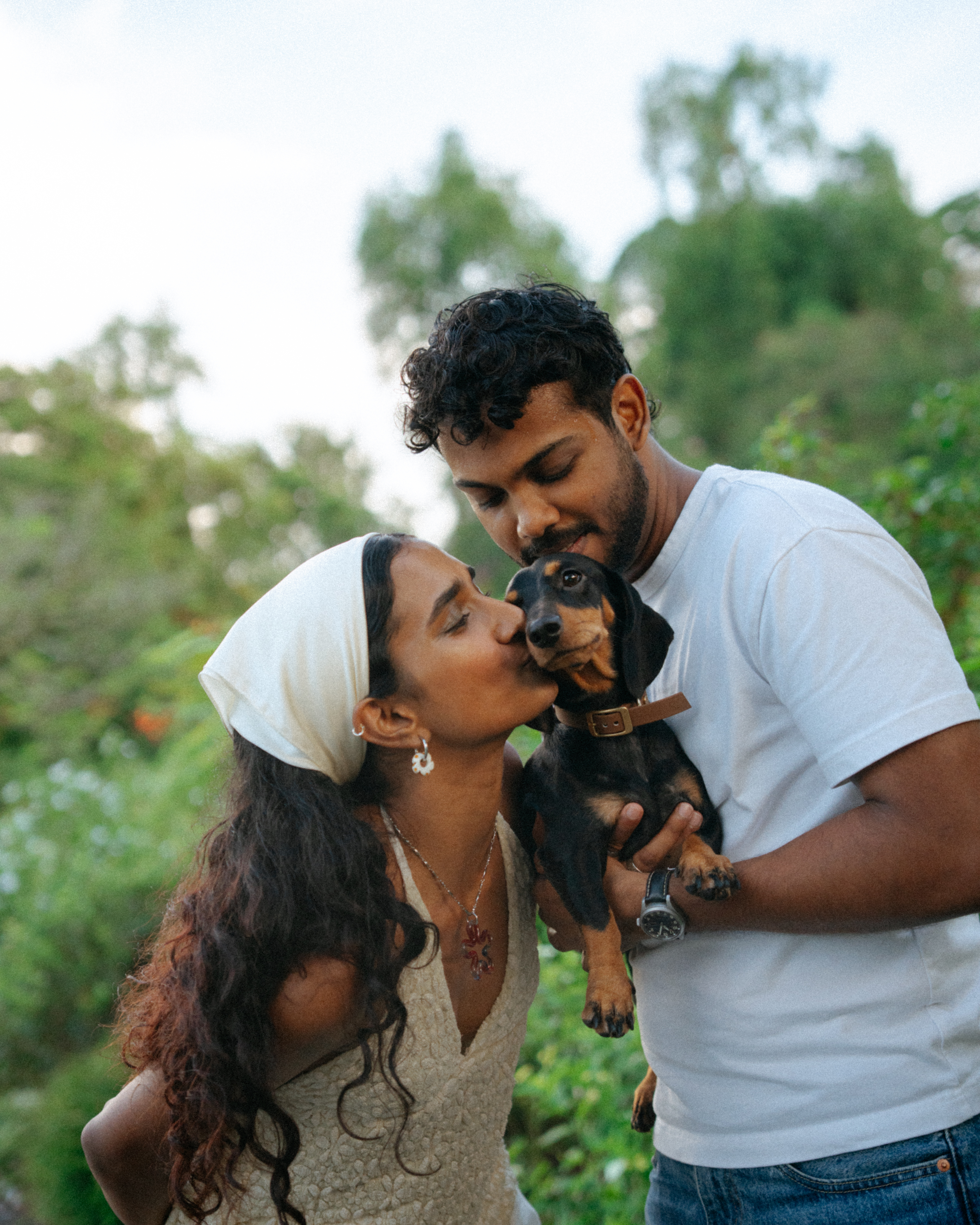 Janani and Dhanush in a warm outdoor portrait