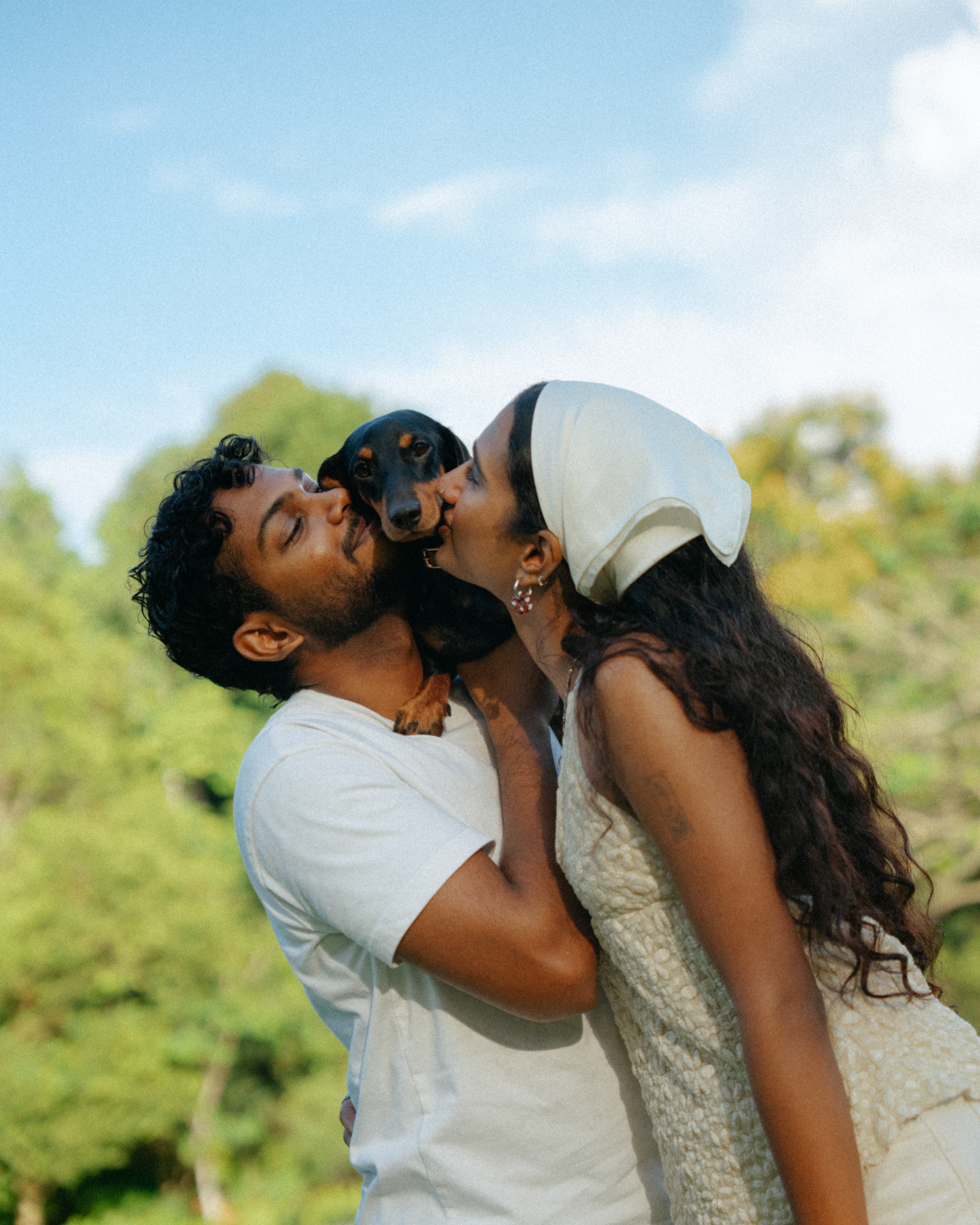 Janani and Dhanush smiling during their couple shoot