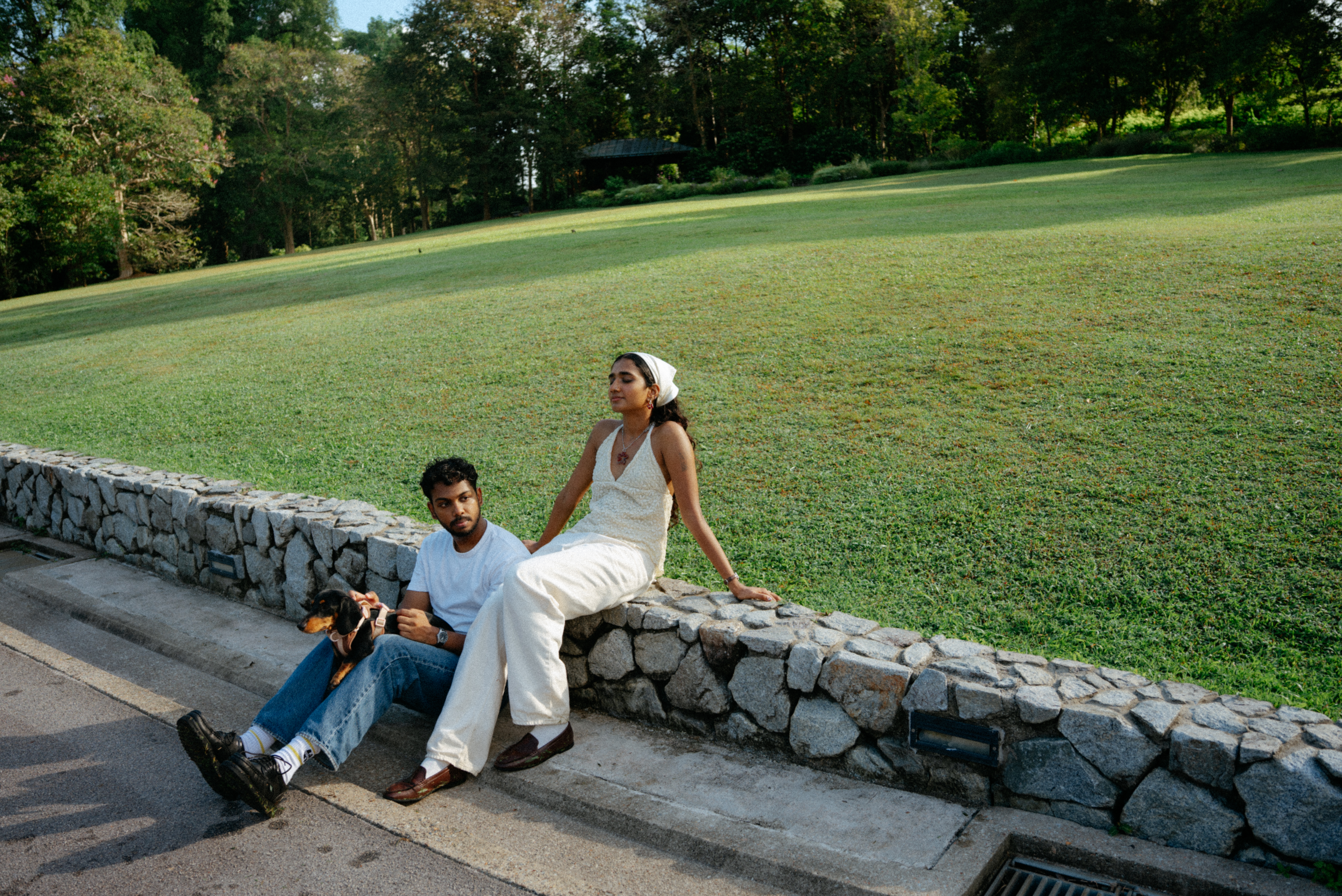 Janani and Dhanush walking together in the garden