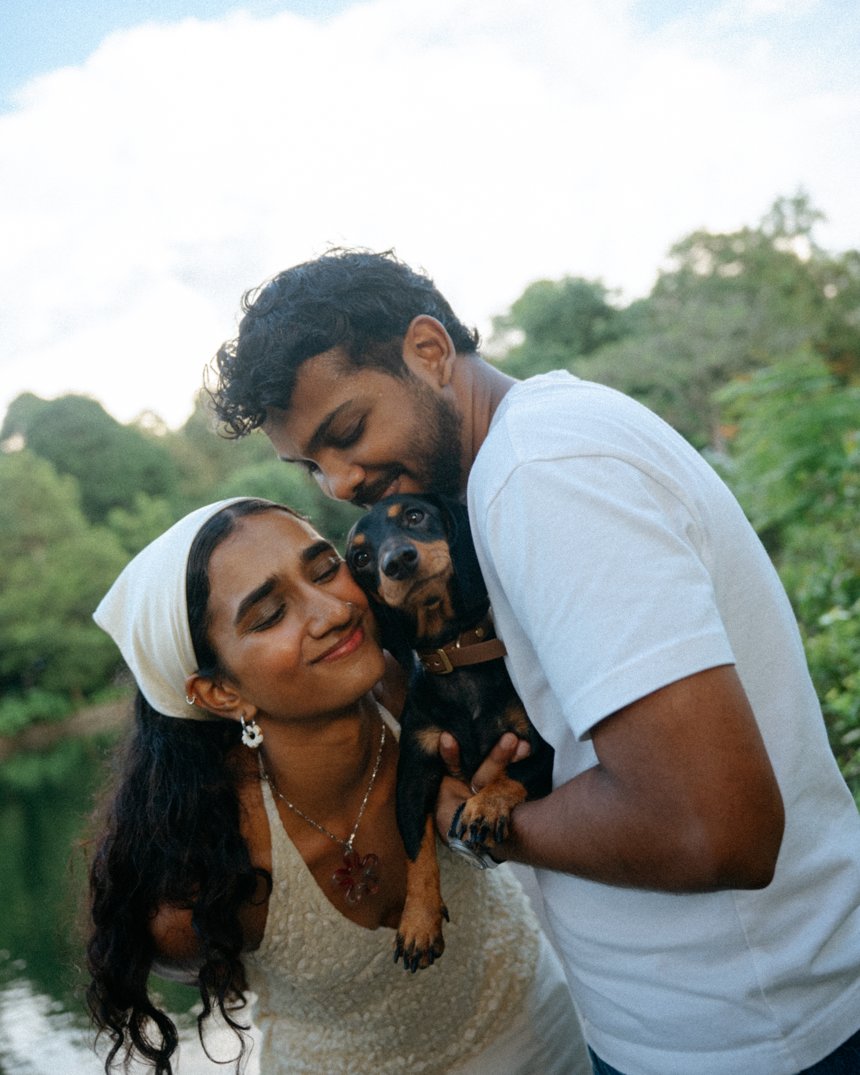 Janani and Dhanush with their dog outdoors