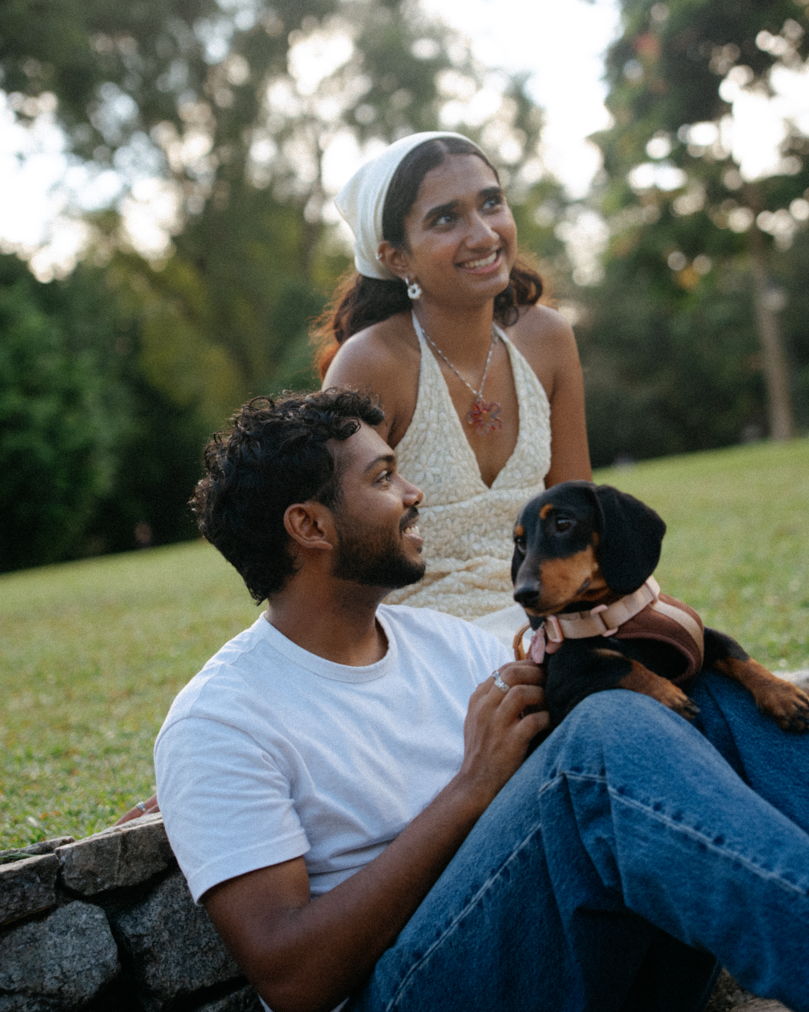 Janani and Dhanush in a playful garden portrait